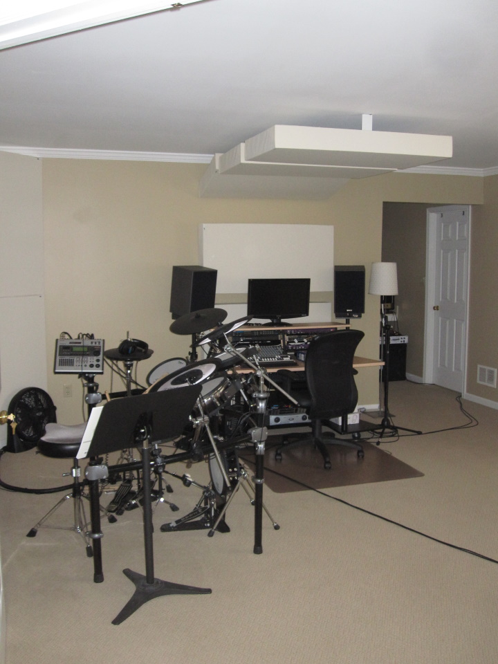 View of studio, looking at the drums and console